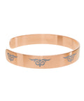 Gold cuff bracelet with engraved tribal swirl design – fashion accessory  
