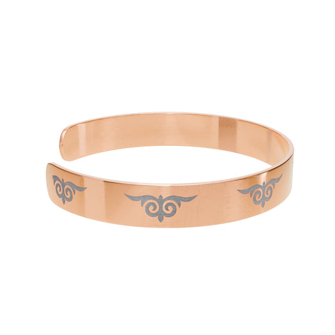 Gold cuff bracelet with engraved tribal swirl design – fashion accessory  
