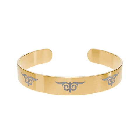 Gold cuff bracelet with engraved tribal swirl design – fashion accessory  
