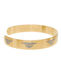 Gold cuff bracelet with engraved tribal swirl design – fashion accessory  
