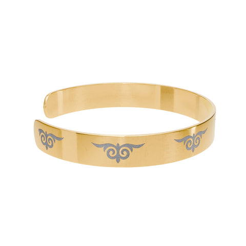 Gold cuff bracelet with engraved tribal swirl design – fashion accessory  
