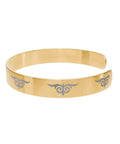 Gold cuff bracelet with engraved tribal swirl design – fashion accessory  
