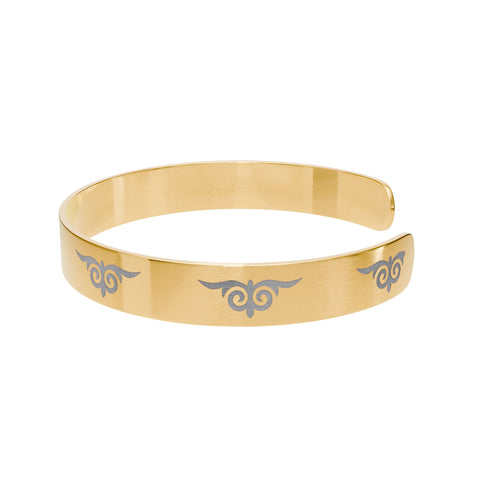 Gold cuff bracelet with engraved tribal swirl design – fashion accessory  
